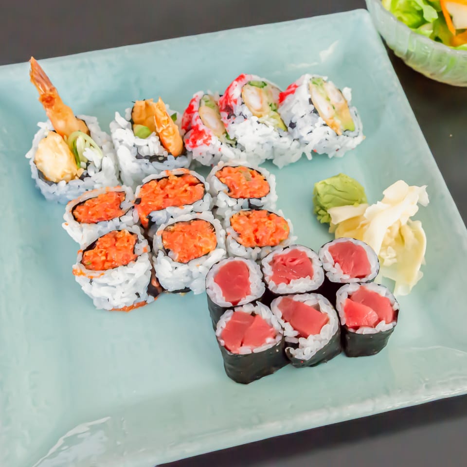 Assortment of Koiso Japanese Restaurant sushi rolls, including shrimp tempura, spicy tuna, and tuna maki.